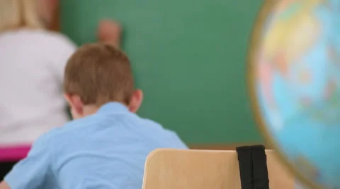 Portrait of young boy in school classroom Video stock 62344260