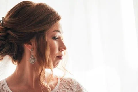 Portrait of a young bride on a light background Stock Photos