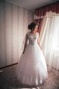 Portrait of a young bride on a light background Stock Photos
