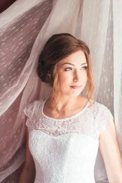 Portrait of a young bride on a light background Stock Photos