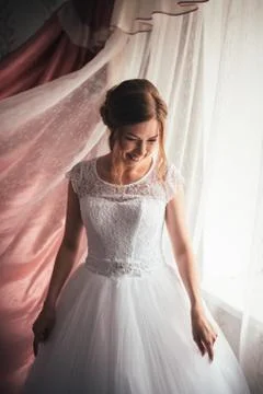 Portrait of a young bride on a light background Stock Photos