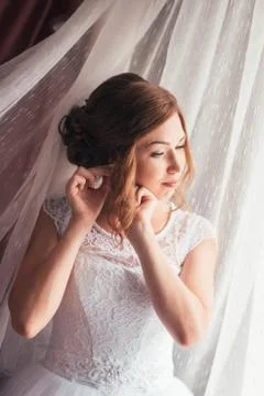 Portrait of a young bride on a light background Stock Photos