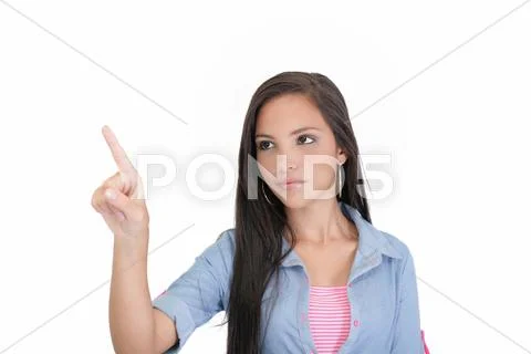 Portrait of young business woman pointing at white background Stock Photos