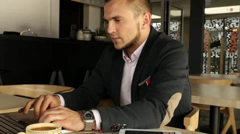 Portrait of a young businessman using mobile phone outside the office Stock Footage 55653384