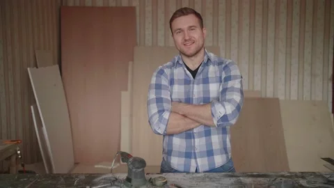 Portrait of a young carpenter behind the workplace Video stock 153493408