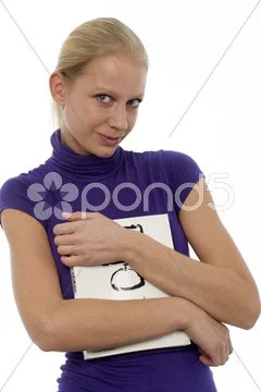 Portrait of a young caucasian woman in casual clothing with a computer book Stock Photos
