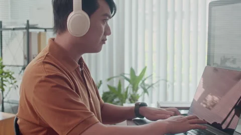 Portrait of Young Coder Testing Software App on Laptop Stock Footage 265069890