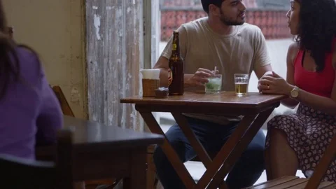 Portrait of young couple drinking beer and hanging out Stock Footage 80118907