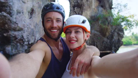 Portrait of young couple in front of cliff before climbing mountian on Railay be Stock Footage 201094283