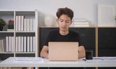 Portrait of young creative man using laptop, planning application developme.. Stock Photos