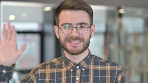 Portrait of Young Designer doing Video chat and Waving Stock Footage 119340510