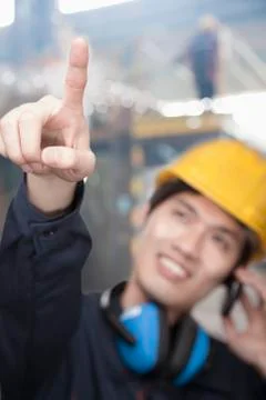 Portrait of Young Engineer Pointing Stock-Fotos