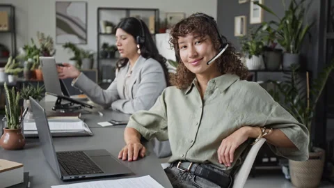 Portrait of Young Female Customer Support Agent Smiling in Office Stock Footage 343625835