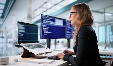 Portrait Of A Young Female Programmer Coding Security Software On Laptop. A F Stock-Fotos