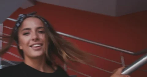 Portrait of young female in stylish outfit, smiling and looking into camera Stock Footage