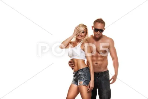 Portrait of young fitness couple on white background Stock Photos
