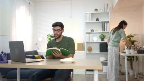 Portrait of a young freelancer smiling while working online via laptop Video stock 309012053