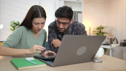 Portrait of a young freelancer smiling while working online via laptop Stock Footage 309013605