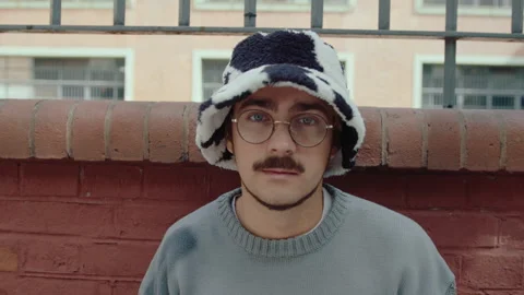 Portrait of Young Gen Z Guy in Trendy Hat on the Street Stock Footage 242297699