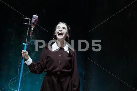 Portrait of a young girl in school uniform as a vampire woman Stock Photos