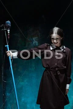 Portrait of a young girl in school uniform as a vampire woman Stock Photos