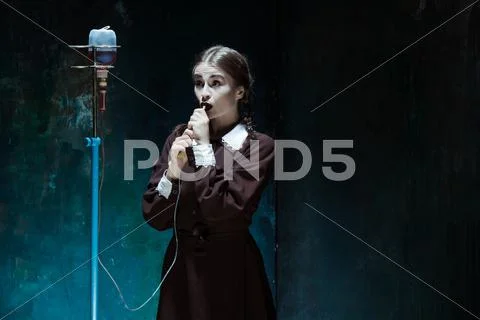 Portrait of a young girl in school uniform as a vampire woman Stock Photos
