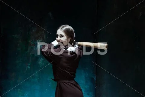 Portrait of a young girl in school uniform as killer woman Stock Photos