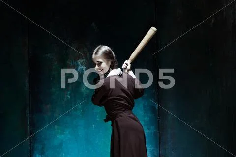 Portrait of a young girl in school uniform as killer woman Stock Photos