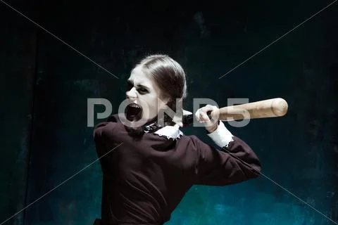 Portrait of a young girl in school uniform as killer woman Stock Photos