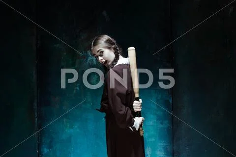 Portrait of a young girl in school uniform as killer woman Stock Photos