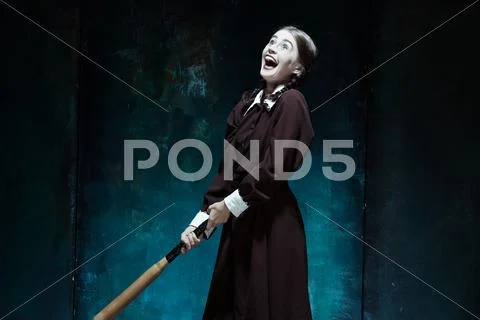 Portrait of a young girl in school uniform as killer woman Stock Photos