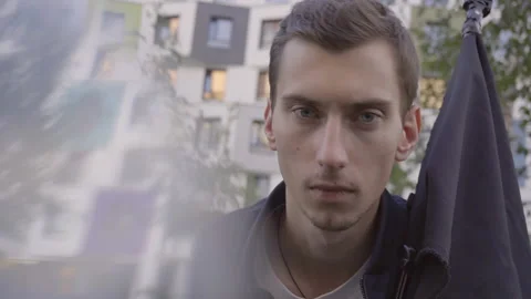 Portrait of a young guy with a black flag Stockbeeldmateriaal 156002048