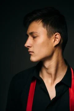 Portrait young guy on a dark studio Stock Photos