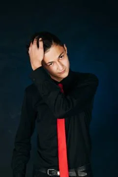 Portrait young guy on a dark studio Stock Photos