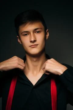 Portrait young guy on a dark studio Stock Photos