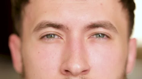 Portrait of a young guy, eyes close-up. Conveying emotions through the eyes. Stock Footage 279878452