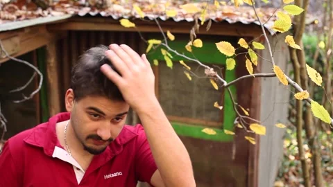 Portrait of a young guy fixing his hair with his hand close up.  Stock Footage 145018637