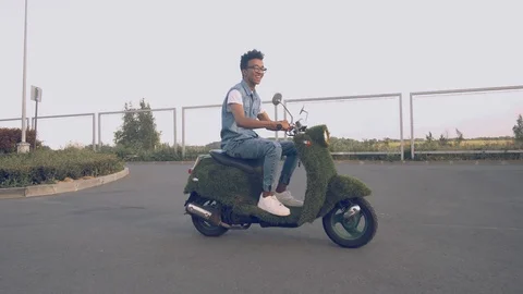 Portrait young guy sitting on his vintage retro motorbike. biker wearing jeans Stock Footage 111594662