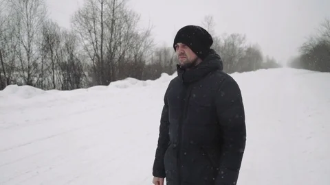 Portrait of a young handsome man with a beard. A bearded man in the winter woods Stock Footage 72734669