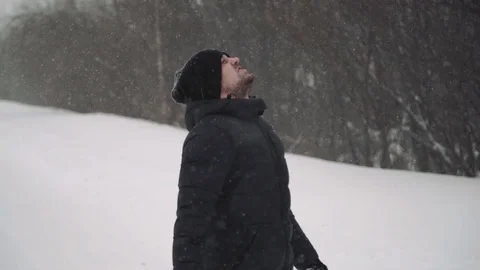 Portrait of a young handsome man with a beard. A bearded man in the winter woods Stock Footage 72734900