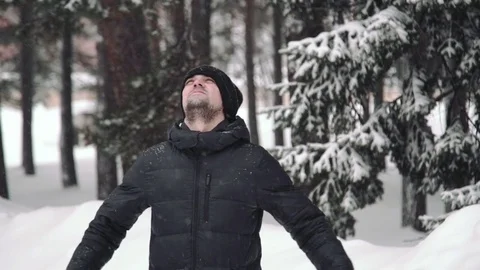Portrait of a young handsome man with a beard. A bearded man in the winter woods Stock Footage 72736161