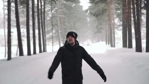 Portrait of a young handsome man with a beard. A bearded man in the winter woods Stock Footage 72737151