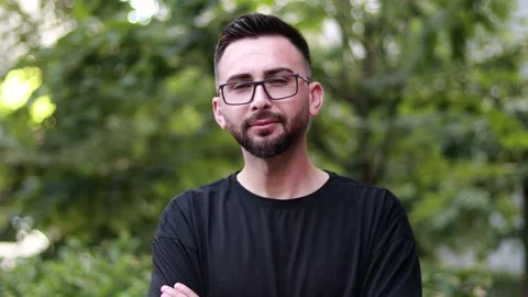 Portrait of young handsome man with beard and glasses Stock Footage 200129004