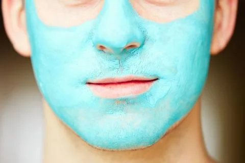 Portrait of young handsome man with facial mask. Fotos Stock