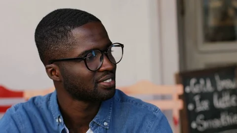 Portrait of young handsome man in glasses and wearing in denim shirt. Guy Stock Footage 81833055