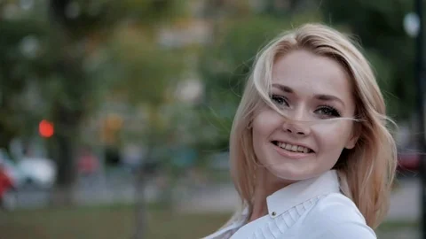 Portrait of young happy blonde businesswoman in the city. Slow motion. Beautiful Stock Footage