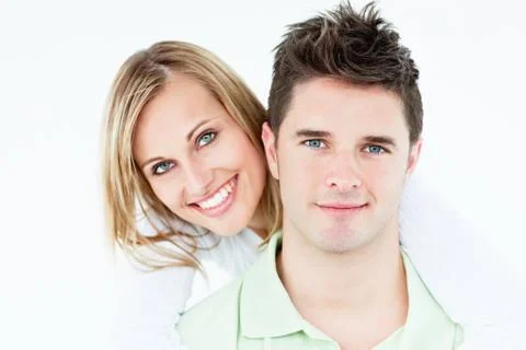 Portrait of a young happy couple standing against a white background Stock Photos
