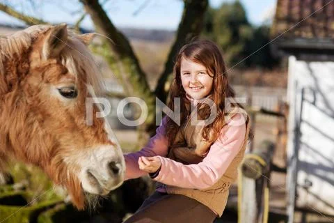 Portrait of a young happy girl and her horse Stock Photos