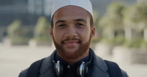 Portrait young happy muslim man smiling enjoying successful urban lifestyle Stock Footage