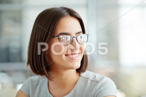 Portrait of a young happy woman in glasses Stock Photos